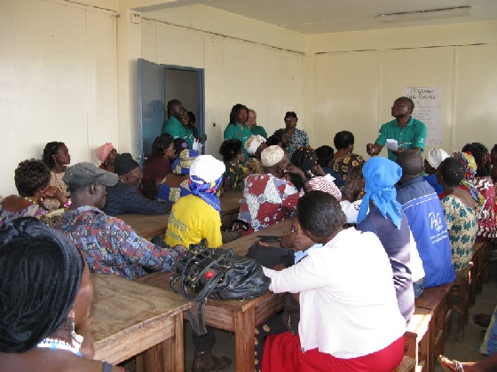 IDF staff speaking at the 2010 Food Basket Distribution